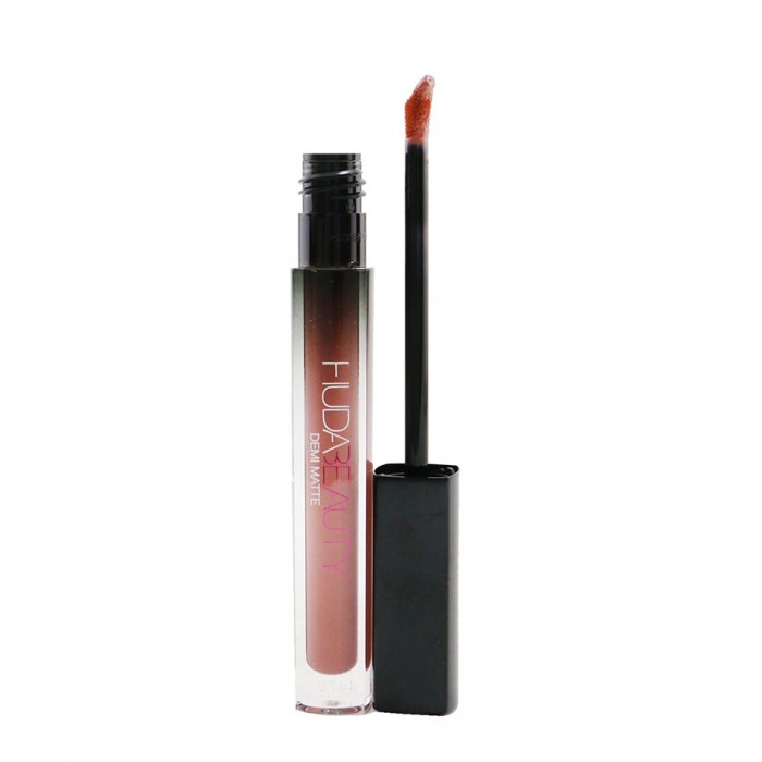 Inspired by Huda?s love for self-expression through makeup, Huda Beauty Demi Matte is a bold Cream Lipstick showcasing a full spectrum of ultra-feminine colors to complement every one of your alter egos. Saturated in pi | Veela Beauty its creamy & soft texture, gives your lips a beautiful